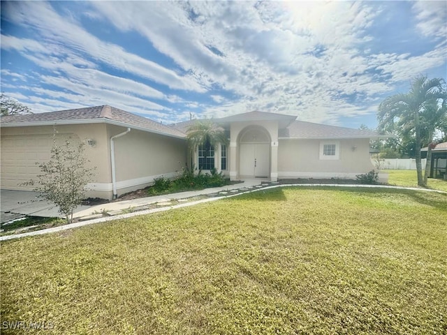 single story home with a front lawn and a garage