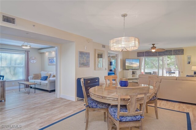 dining space featuring ceiling fan and light hardwood / wood-style flooring