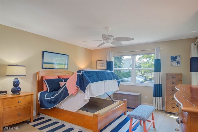 bedroom featuring ceiling fan and radiator heating unit