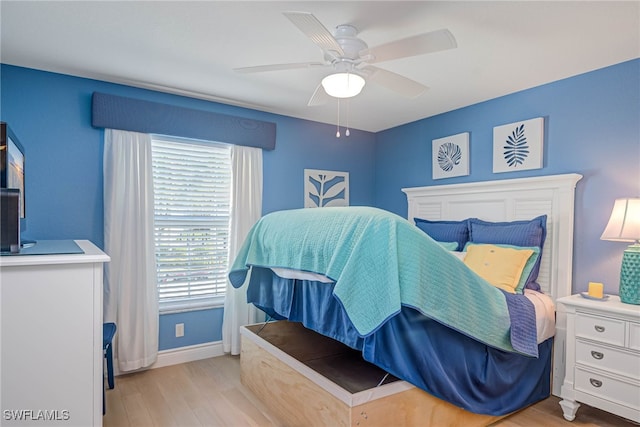 bedroom featuring ceiling fan and light hardwood / wood-style flooring