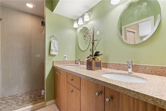 bathroom with vanity and a shower with door