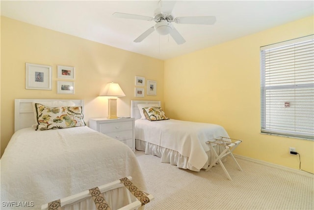 bedroom with light colored carpet and ceiling fan