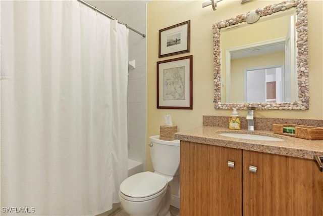 full bathroom featuring vanity, shower / bath combination with curtain, and toilet