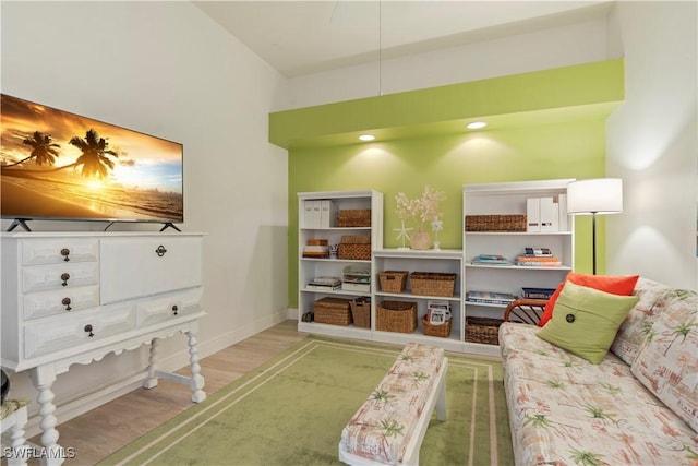 recreation room with light hardwood / wood-style floors