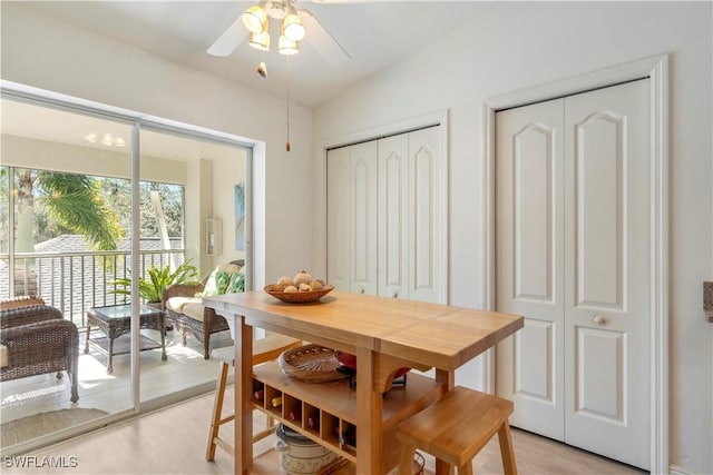 dining area featuring lofted ceiling and ceiling fan