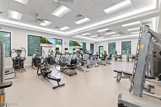 gym with a paneled ceiling