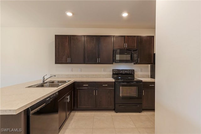 kitchen with black appliances, sink, light tile patterned floors, kitchen peninsula, and dark brown cabinets