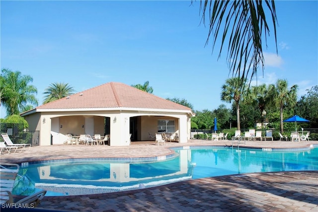 view of swimming pool with a patio