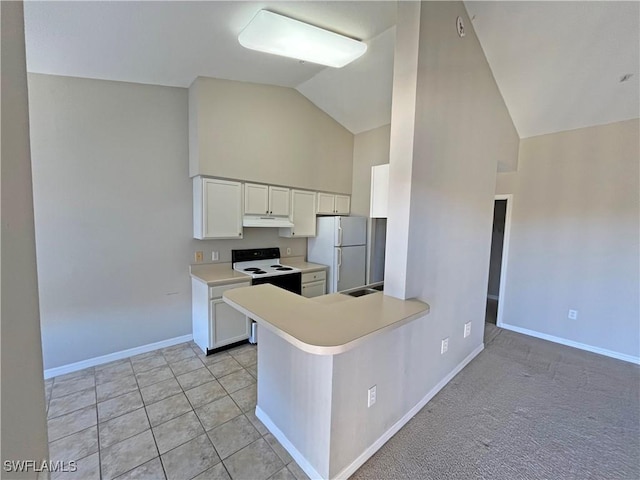 kitchen featuring white appliances, white cabinets, vaulted ceiling, light tile patterned floors, and kitchen peninsula