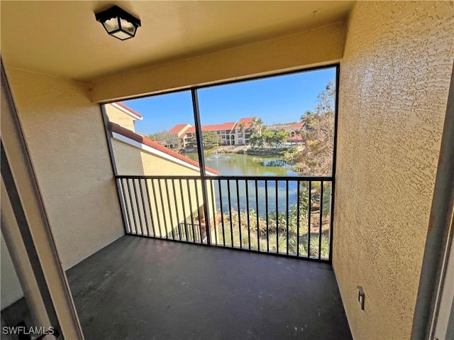 balcony featuring a water view