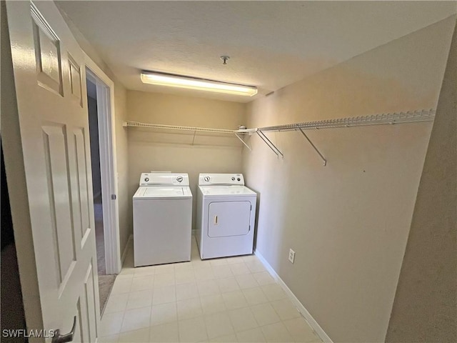 laundry area with independent washer and dryer