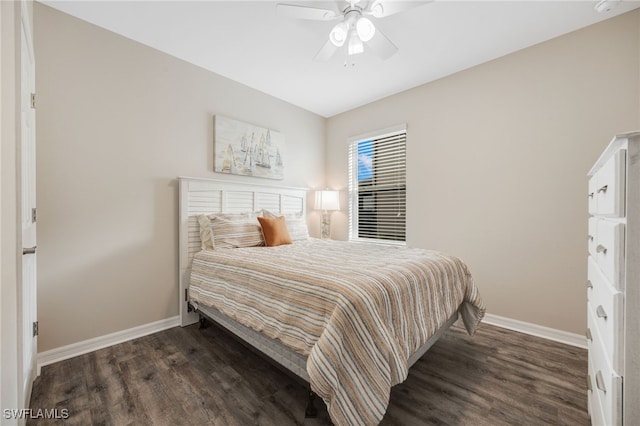 bedroom featuring ceiling fan and dark wood-type flooring