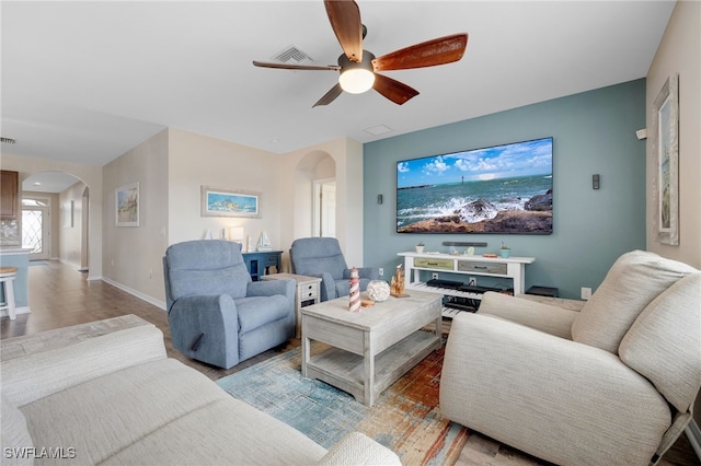 living room featuring ceiling fan