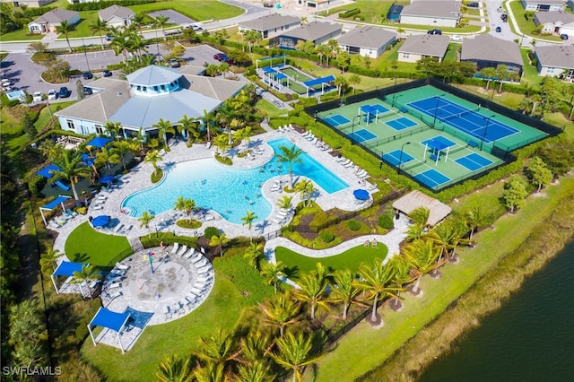 birds eye view of property with a water view