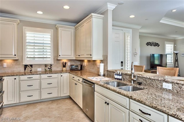 kitchen featuring light stone countertops, tasteful backsplash, ornamental molding, sink, and dishwasher