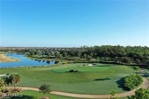 surrounding community featuring a water view