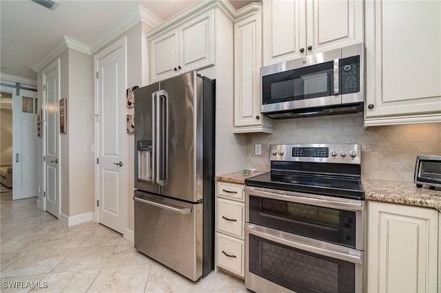 kitchen with light tile patterned flooring, light stone countertops, ornamental molding, and appliances with stainless steel finishes