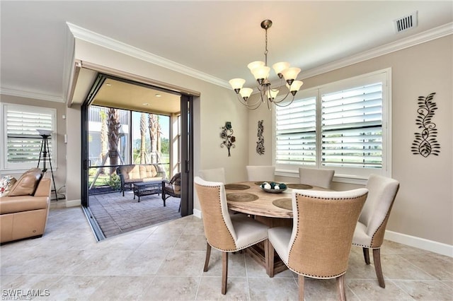 tiled dining room with ornamental molding and a chandelier