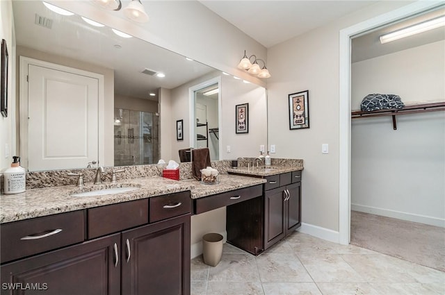 bathroom featuring vanity and walk in shower