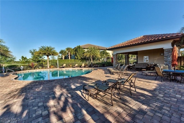 view of swimming pool featuring a patio