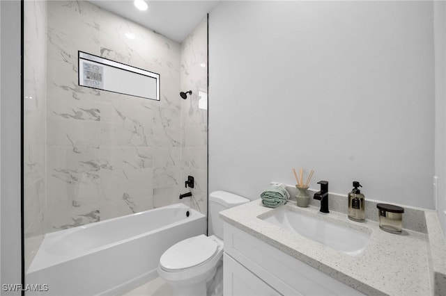 full bathroom featuring toilet, vanity, and tiled shower / bath