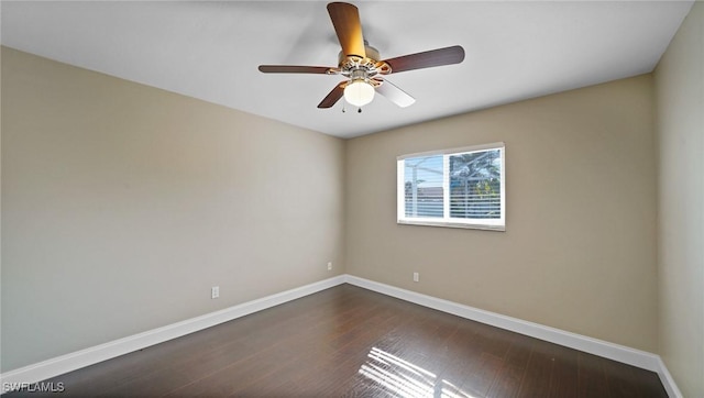 spare room featuring ceiling fan and dark hardwood / wood-style floors