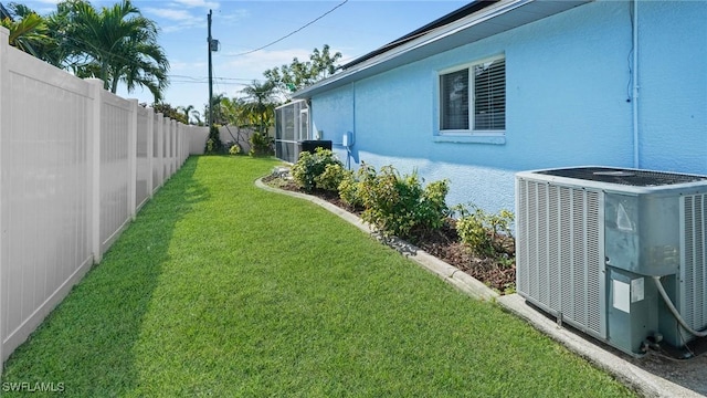 view of yard featuring central air condition unit