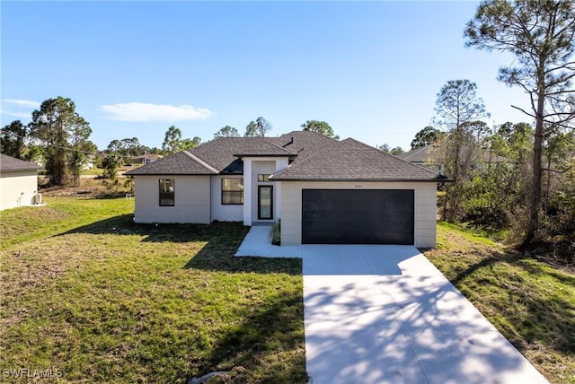 view of front of home with a garage and a front lawn