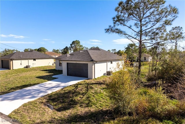 view of front of house featuring central AC and a front lawn