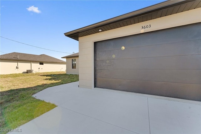 garage featuring a lawn