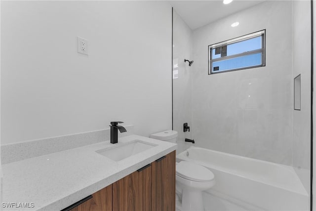 full bathroom with vanity, toilet, and tiled shower / bath