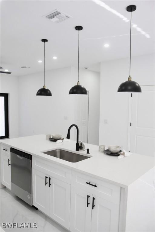 kitchen featuring a sink, visible vents, white cabinets, marble finish floor, and dishwasher