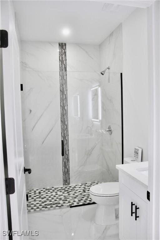 bathroom with toilet, marble finish floor, a marble finish shower, and vanity