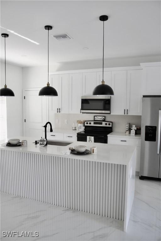 kitchen featuring stainless steel appliances, a sink, visible vents, white cabinetry, and light countertops