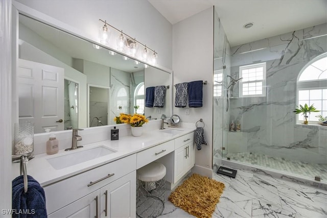 bathroom featuring vanity and a tile shower