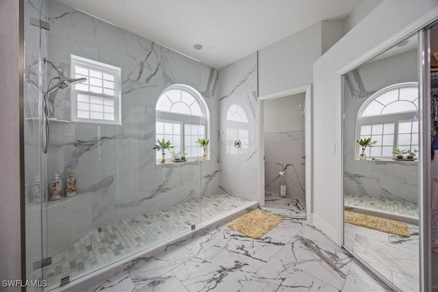 bathroom with tiled shower