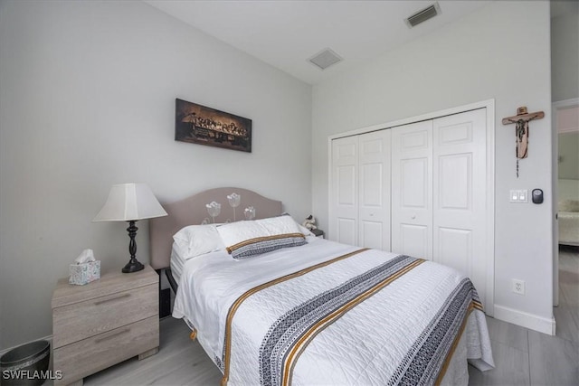 bedroom featuring a closet and light hardwood / wood-style flooring