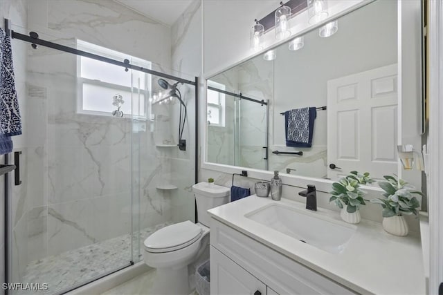 bathroom featuring vanity, toilet, and walk in shower