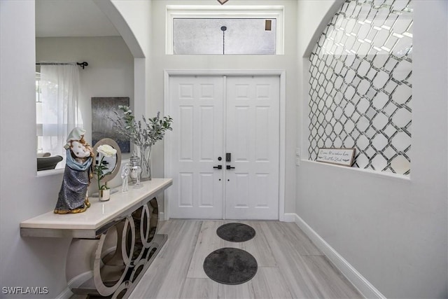 foyer entrance with light wood-type flooring