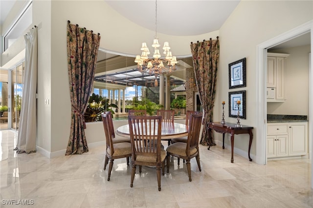 dining space featuring a notable chandelier