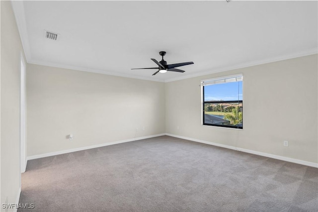 spare room with carpet, ceiling fan, and ornamental molding