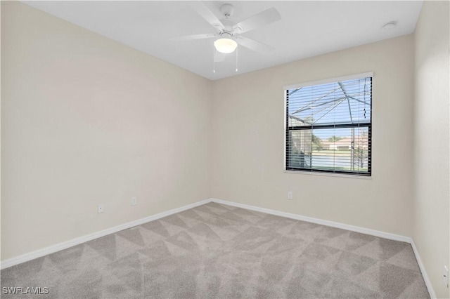 carpeted empty room with ceiling fan