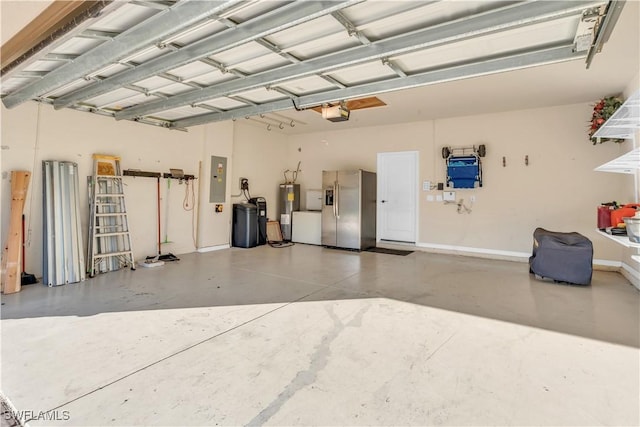 garage featuring a garage door opener, electric panel, stainless steel fridge, and water heater