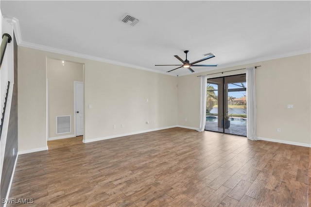 unfurnished room with crown molding, ceiling fan, french doors, and wood-type flooring