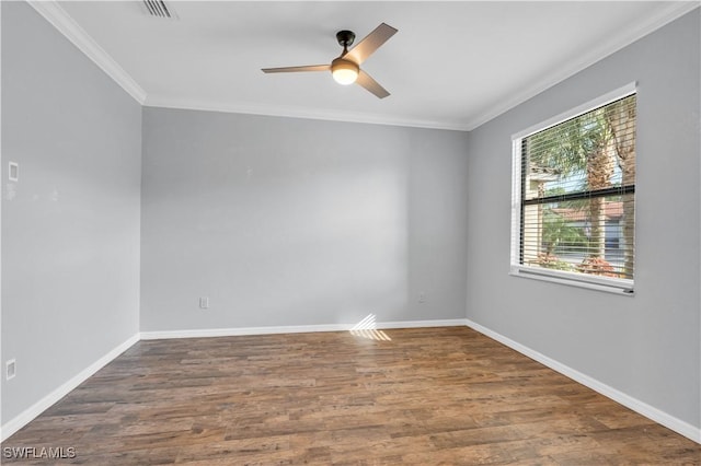 spare room with ceiling fan, crown molding, and dark hardwood / wood-style floors