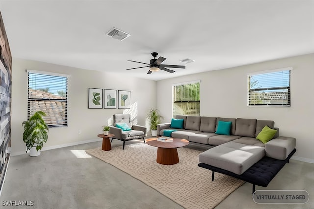 living room with light colored carpet and ceiling fan