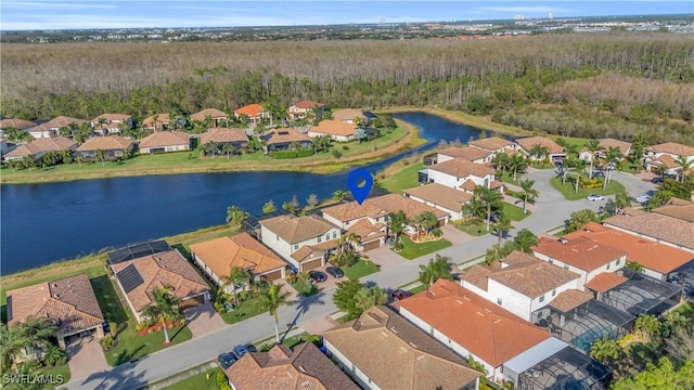 drone / aerial view featuring a water view and a residential view