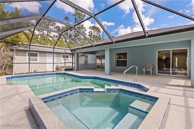 view of pool featuring a patio area and a pool with connected hot tub