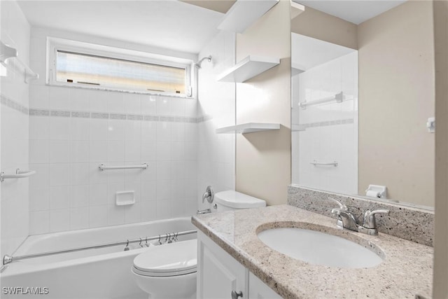 full bathroom featuring vanity, toilet, a wealth of natural light, and tiled shower / bath combo