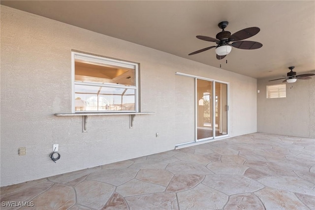 view of patio / terrace featuring ceiling fan